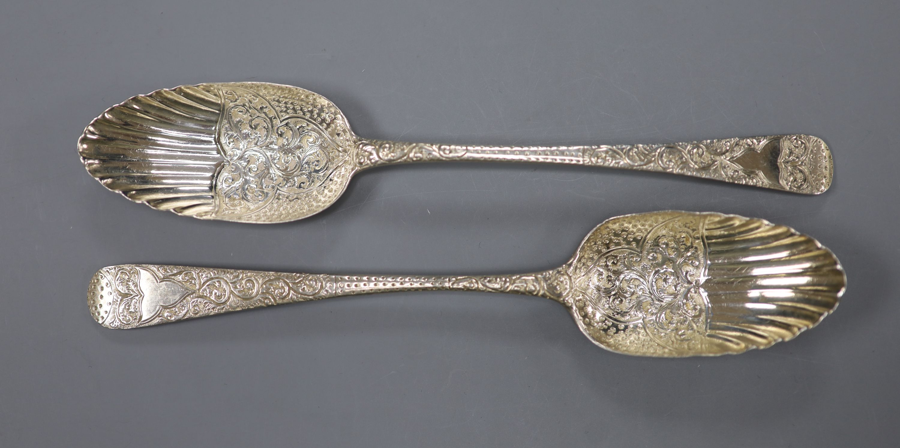 Two similar George III silver berry spoons, London, 1805 & 1814 and a cased set of six silver coffee spoons.